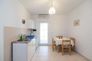 Fridge, stovetop, dining tables - Apartments Boguvila - Two-Bedroom Basic Apartment with Terrace (A1) - (ST) (Supetar)