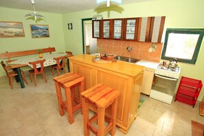 Fridge, oven, stovetop, dining tables