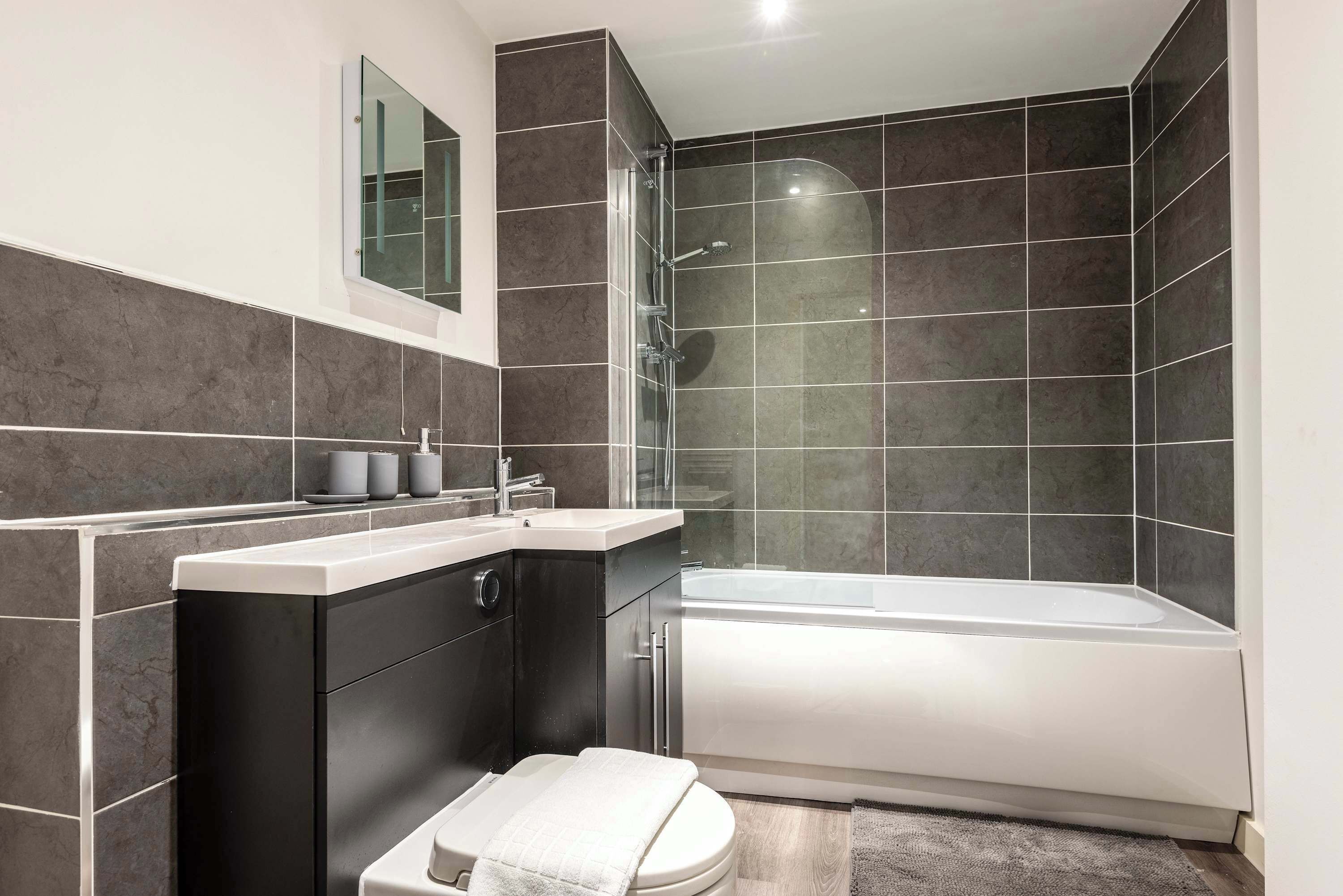 Shower, hair dryer, towels, shampoo