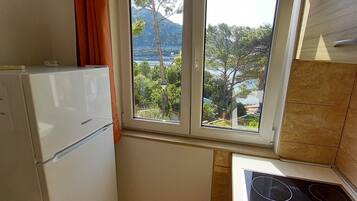 Fridge, stovetop, dining tables