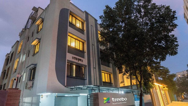 A modern building with a sign reading "treebo Royal Comfort Attitude." - Treebo Royal Comfort Atithi (Pune)