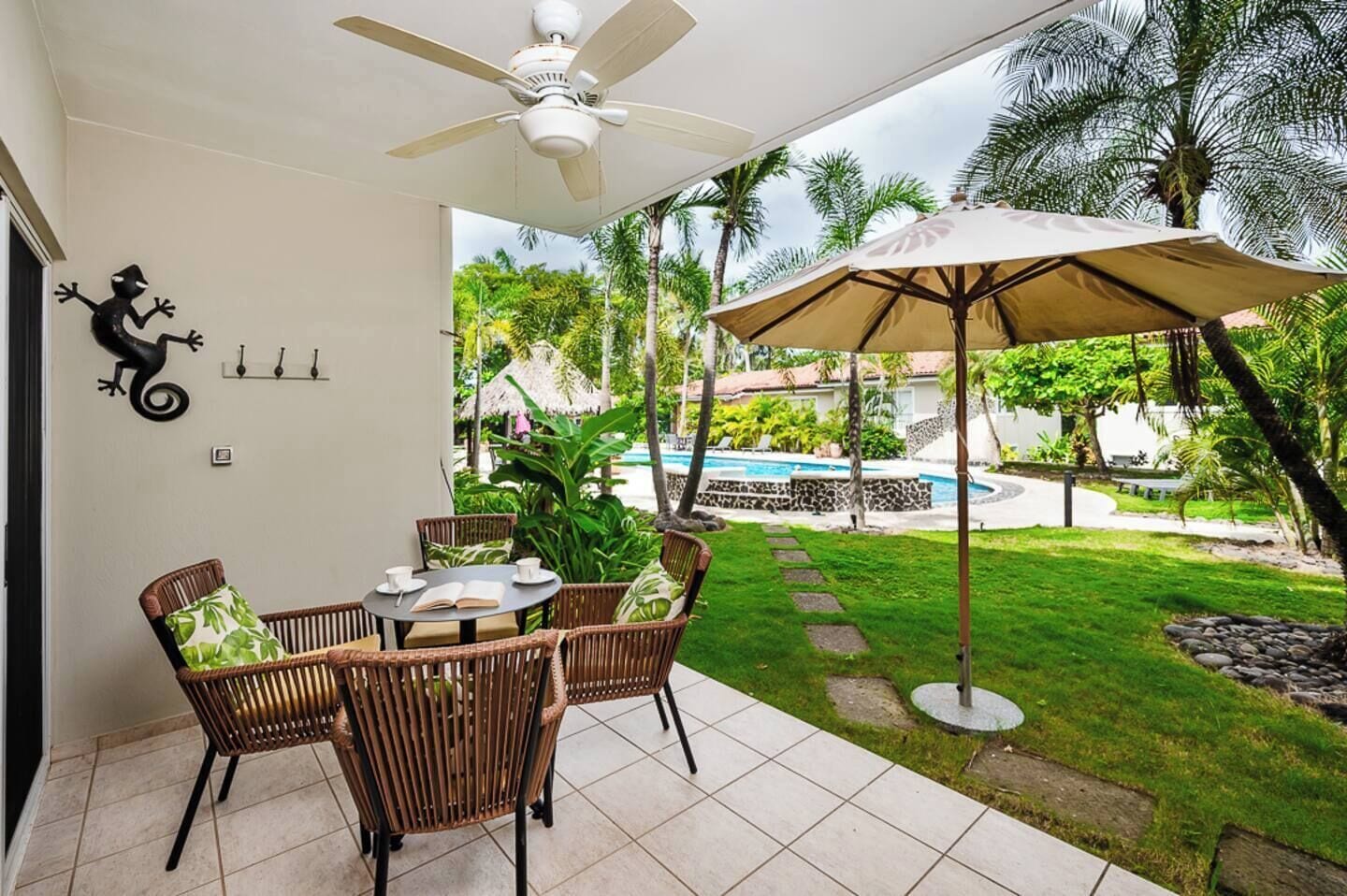 Private terrace of this 1-bedroom Langosta Beach condo, perfect for enjoying tropical breezes, lush garden views, and relaxing moments just steps from the beach during your Tamarindo vacation.