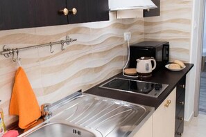 Fridge, microwave, stovetop, dining tables