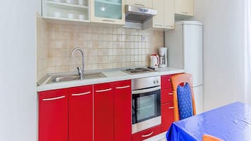 Fridge, oven, stovetop, dining tables