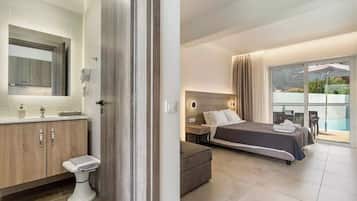 Junior Suite, Pool View | Bathroom | Shower, hair dryer, slippers, soap