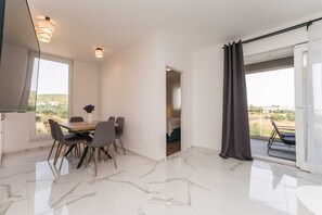 Enjoy a meal in the dining area with a view of the surrounding landscape.