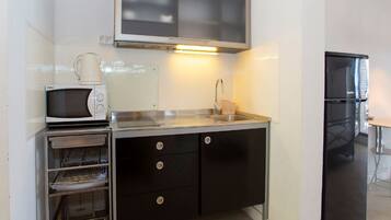Fridge, microwave, stovetop, dining tables
