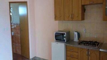 Fridge, microwave, stovetop, dining table