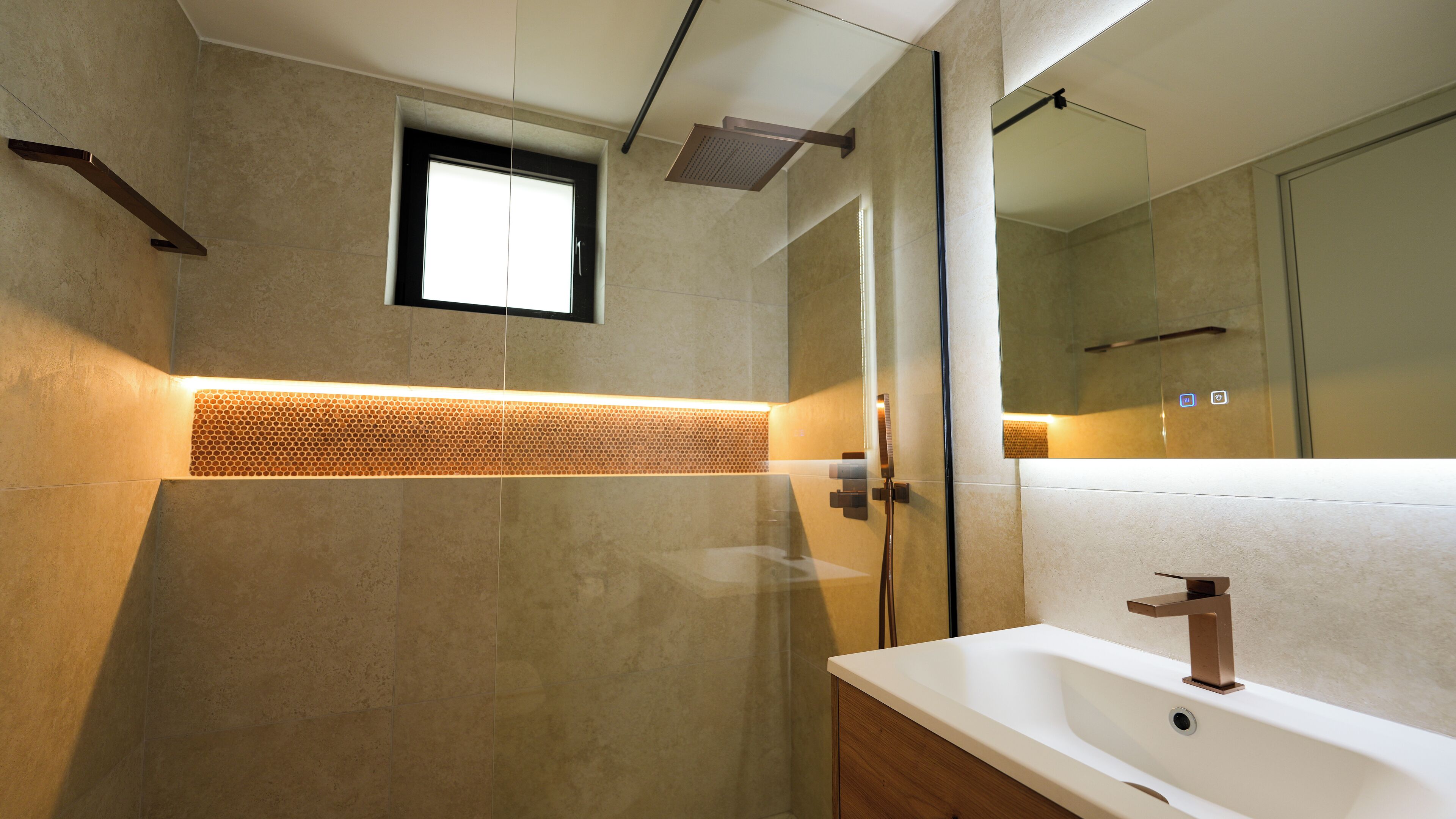 A modern bathroom with a large mirror, a shower area, and a bathtub.
