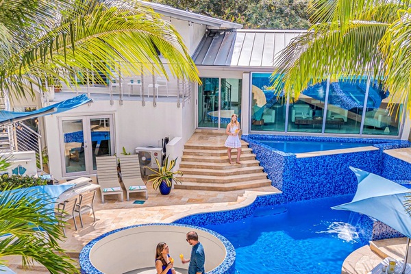 Waterfront masterpiece with its ship-like, nautical-inspired design. The open-concept living, dining, and chef's kitchen are bathed in light from a grand window, framing Fort Lauderdale's skyline and tranquil canal.