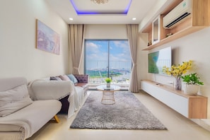 Superior Apartment, 3 Bedrooms, Kitchen, City View | Living area | 35-inch TV with cable channels