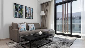 Deluxe Apartment, Balcony | Living area