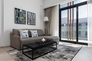 Appartement Deluxe, balcon | Coin séjour