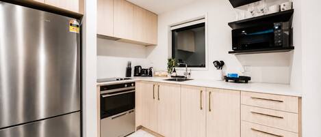 Coffee/tea maker, fridge, microwave, oven