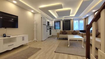 Villa, Lake View | Living area | 45-inch Smart TV with satellite channels, heated floors