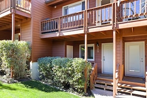 Guests can enjoy a balcony with a garden view from this two-story building.