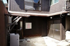 A building with a sign reading 'ahtrb' and a covered entrance. - Honmachi-Shin North (Kyoto)