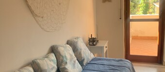 Charming 2-bedroom condo with AC, WiFi just Steps from the Beach