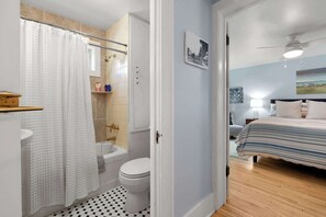A bathroom with a shower, toilet, and sink. - Downtown Baileys Harbor Waterfront: Limestone Edge (Baileys Harbor)