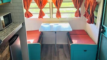 Fridge, microwave, coffee/tea maker, cookware/dishes/utensils