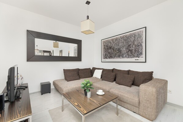 Apartment, 2 Bedrooms, 2 Bathrooms | Living room | 32-inch flat-screen TV with cable channels, DVD player - Large Apartment With Desk by Renters (Kraków)