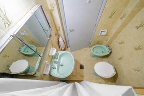 Bidet, towels, toilet paper