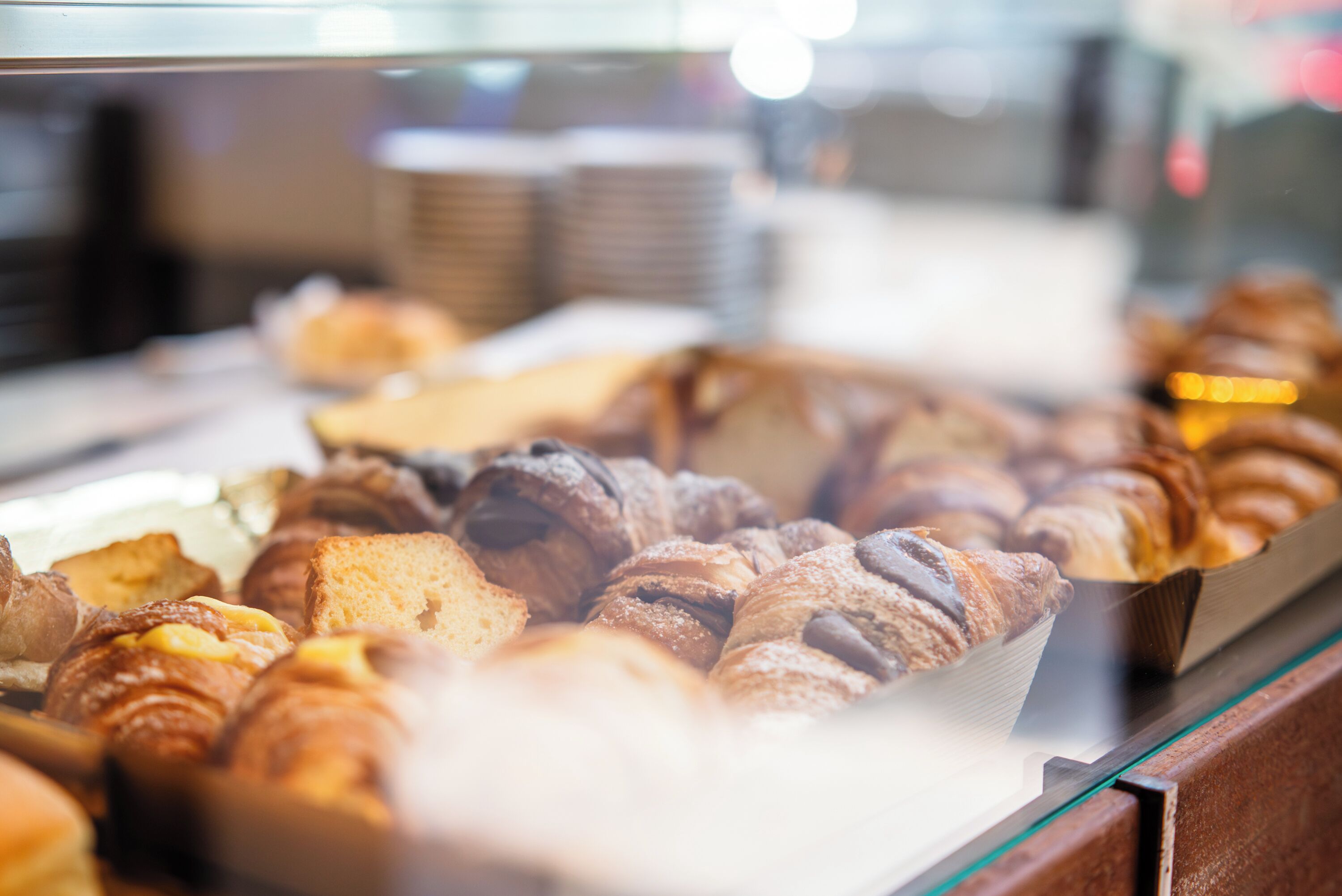 A bakery display case with various baked goods.