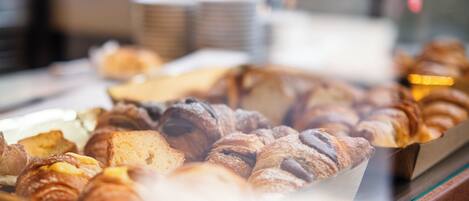 A bakery display case with various baked goods.
