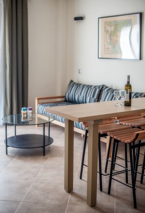 Deluxe Apartment | Living area | 27-inch flat-screen TV with satellite channels, TV - Villa Despina Green Suites (Kassandra)