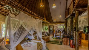 A room with a bed under a canopy, a second bed, a small table, and a mirror. - Mbweha Camp Lake Nakuru (Nakuru)