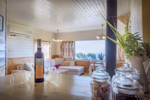 Family Villa, 2 Bedrooms, Kitchen, Mountain View | Living area | LCD TV, fireplace, pay movies