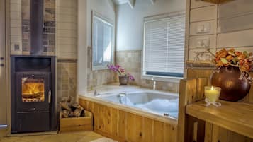 Honeymoon Chalet, Jetted Tub, Mountain View | Living area | LCD TV, fireplace, pay movies