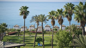 Private beach, black sand, sun-loungers, beach umbrellas