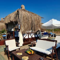 Private beach, black sand, sun-loungers, beach umbrellas