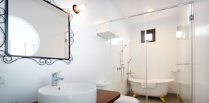 A modern bathroom with a round sink, a freestanding bathtub, and a glass-enclosed shower area. - Whilom SeaShoreHotel (Hengchun)