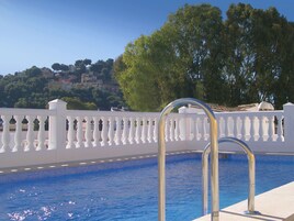 Outdoor pool, open 10:00 AM to 9:00 PM, pool umbrellas, pool loungers