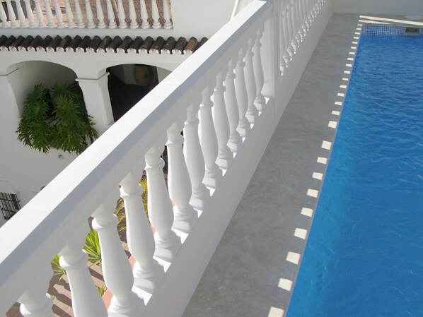 Outdoor pool, open 10:00 AM to 9:00 PM, pool umbrellas, pool loungers