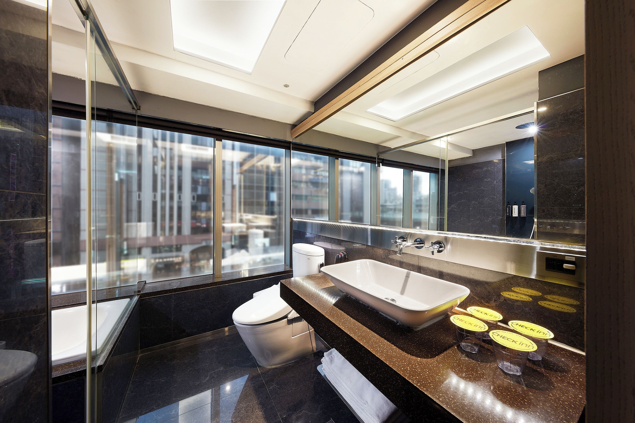 Deluxe Quadruple Room | Bathroom | Separate tub and shower, rainfall showerhead, hair dryer, towels