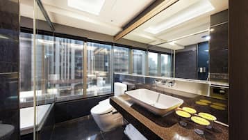 Deluxe Quadruple Room | Bathroom | Separate tub and shower, rainfall showerhead, hair dryer, towels