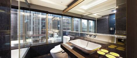 Deluxe Quadruple Room | Bathroom | Separate tub and shower, rainfall showerhead, hair dryer, towels