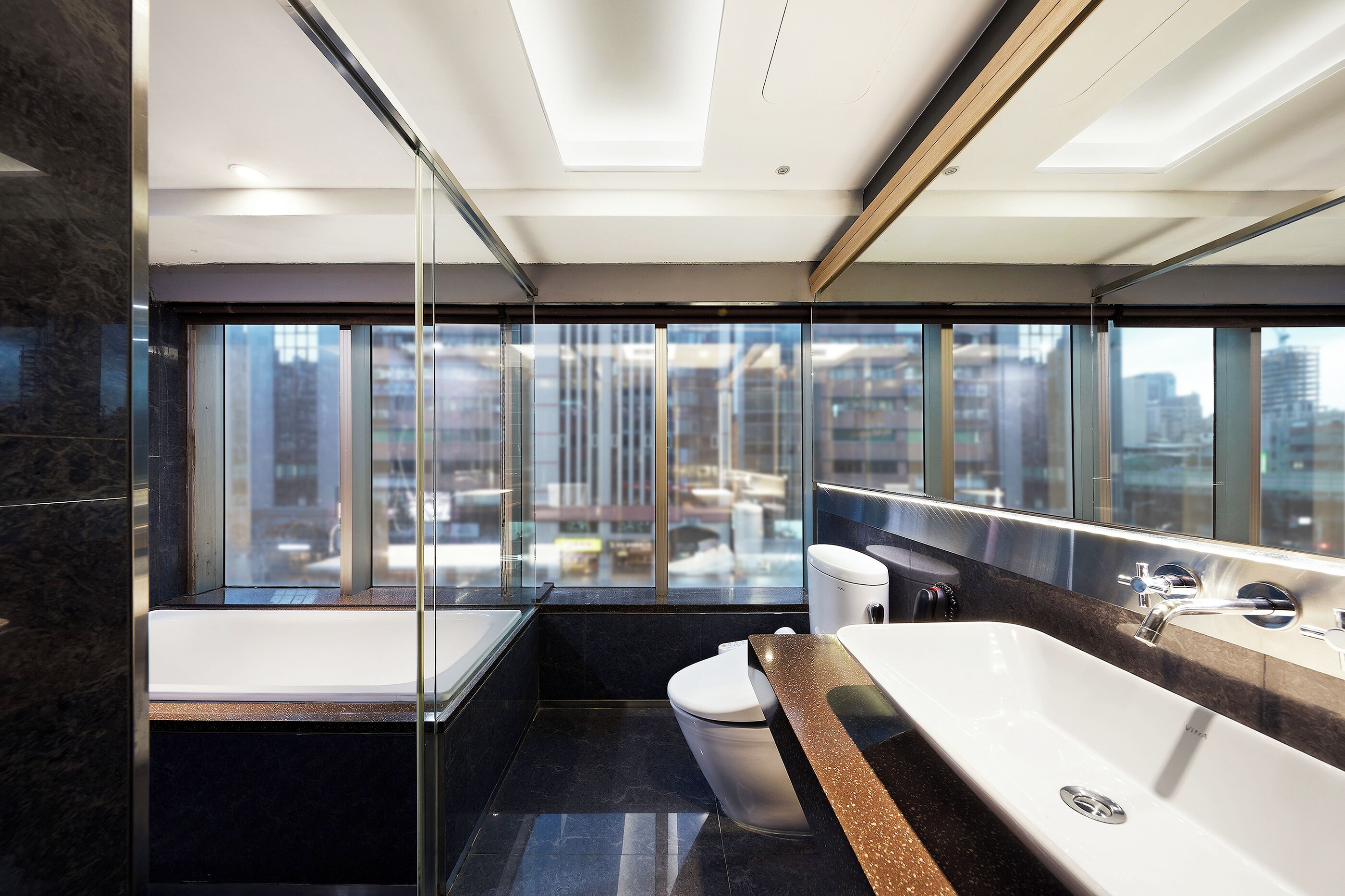 Deluxe Quadruple Room | Bathroom | Separate tub and shower, rainfall showerhead, hair dryer, towels