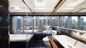 Deluxe Quadruple Room | Bathroom | Separate tub and shower, rainfall showerhead, hair dryer, towels