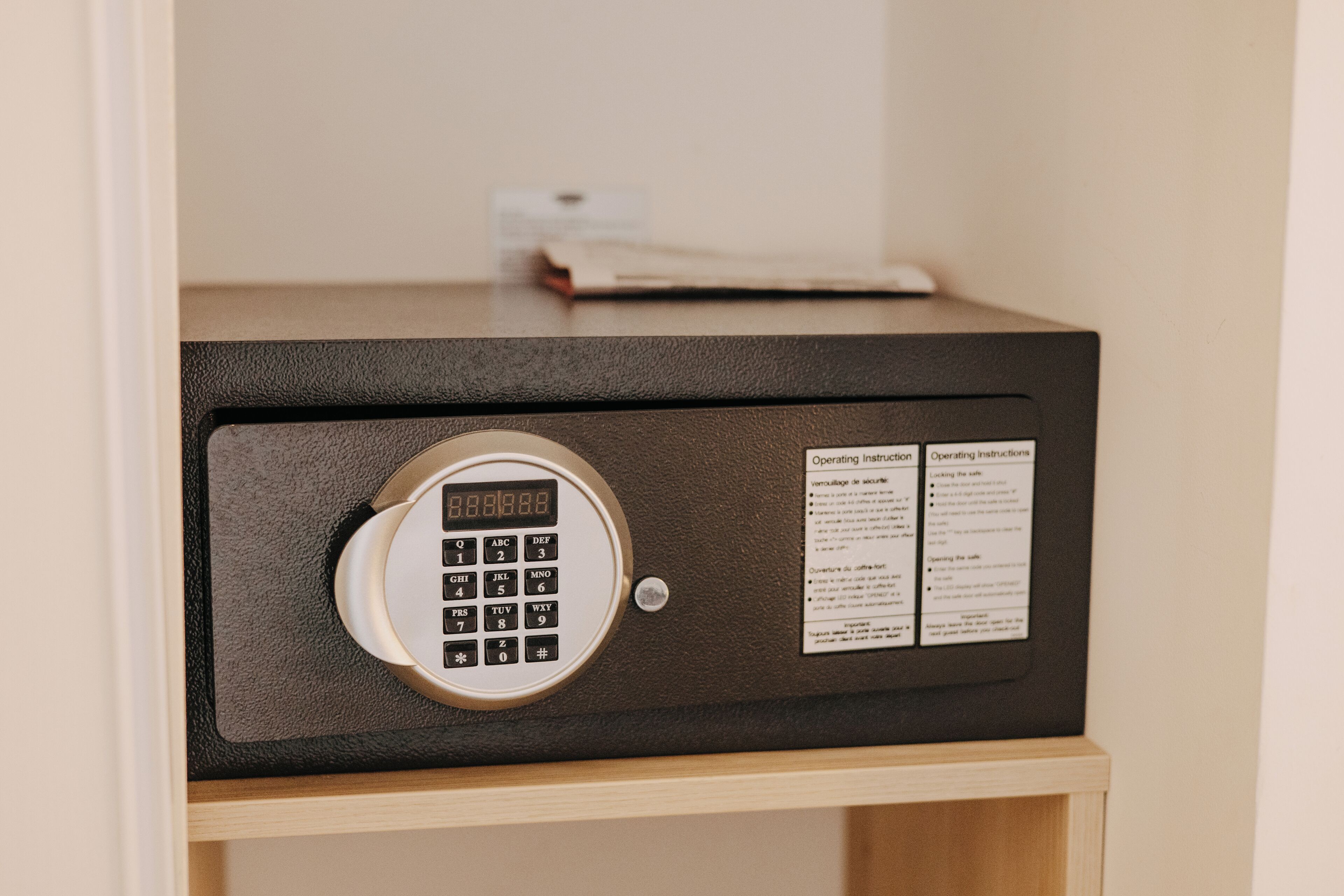 A safe with a keypad and operating instructions.
