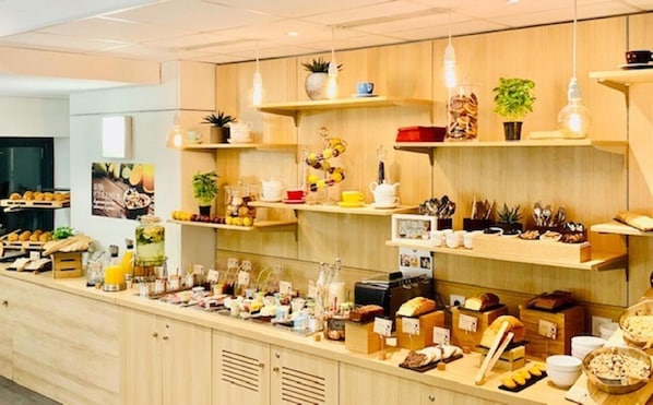 Enjoy a diverse spread of international cuisine at our buffet, featuring a variety of food options and serving stations.