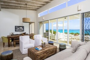 Three Bedroom Peninsula Oceanfront Reef Villa | Living room | Flat-screen TV, iPod dock - Sailrock South Caicos, Small Luxury Hotels of the World (Cockburn Harbour)