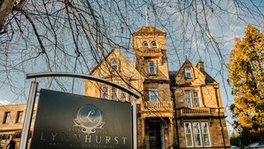 A historic building with a sign for the Lynnhurst Hotel, Bar, and Restaurant, established in 1959. - The Lynnhurst Hotel (Johnstone)