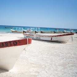 On the beach, white sand, sun-loungers, beach umbrellas