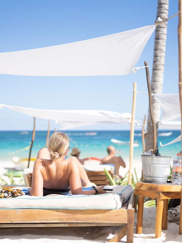 On the beach, white sand, sun loungers, beach umbrellas