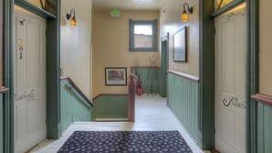 A hallway with doors labeled "201" and "Private." - Nobody's Inn (Durango)
