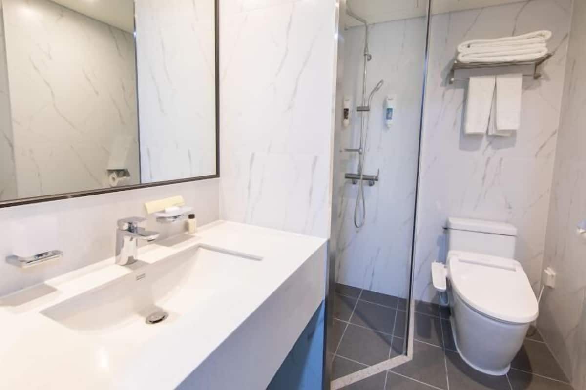 Bathroom | Shower, hair dryer, slippers, towels